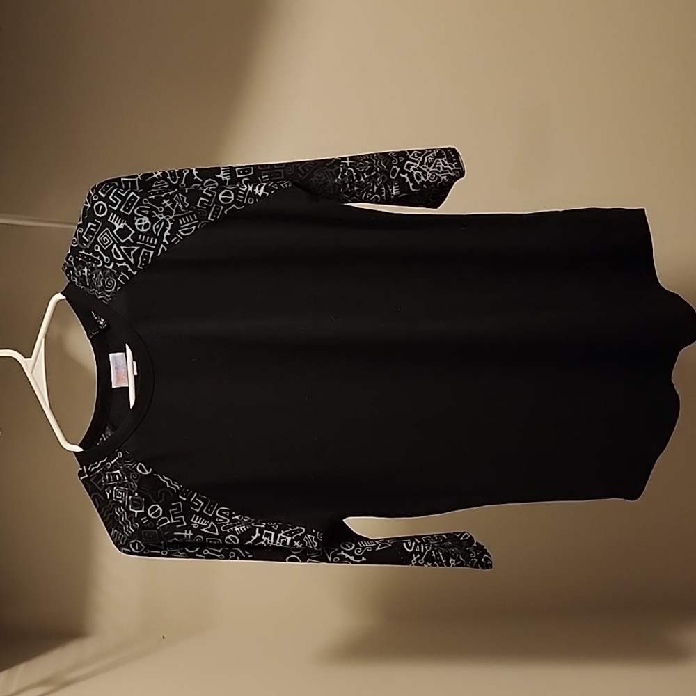Lularoe black with fun designs on sleeves that are 3 quarter length